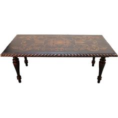 an ornately decorated wooden table with black and gold paint on the top, against a white background