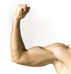 a man is flexing his arm in the air