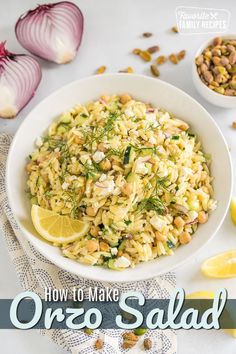 a white bowl filled with food next to sliced lemons and garlic on top of a table