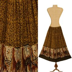 Notations Clothing Company long tapestry skirt made in India with leopard print and giraffe design, stretchy elastic waist. Vintage condition - excellent.  Material - 100% cotton - breezy lightweight tapestry   Size - L - please check measurements>  Waist when lax - 28" - stretches to 46"  Length - 36" More Skirts > https://www.etsy.com/shop/OpenMarketVintage?ref=seller-platform-mcnav&section_id=18659230 Visit our shop at https://www.etsy.com/shop/OpenMarketVintage Notations clothing Skirt- Tapestry Skirt- Long Skirt- Boho Skirt- Hippie Skirt- Maxi Skirt- Ethnic Skirt- Leopard Print Skirt- Peasant Skirt- Festival Bohemian Skirt- Indian Skirt- Animal Print- Giraffes- Notations- Indian Skirt Long Skirt Boho, Tapestry Skirt, Hippie Rock, Womens Long Skirt, Hippie Skirt, Indian Skirt, Denim Jacket With Fur, Hippie Tapestry, Peasant Skirt