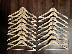 several wooden clothes hangers with numbers on them