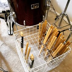 Drum stick holder fashioned from old wire shelves and zip ties partially filled with drum sticks. Drum Stick Storage Ideas, Drumstick Holder Diy, Drum Stick Holder, Band Room Ideas, Drumstick Holder, Music Room Storage, Band Classroom, Music Room Organization