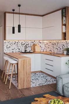 the kitchen is clean and ready to be used as a living room or dining area