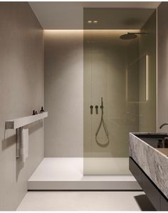 a bathroom with a sink, mirror and shower head in the wall next to it