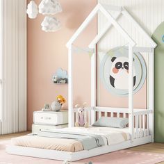 a child's bedroom with pink walls, white furniture and a panda themed bed