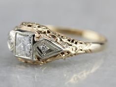 Vintage meets modern in this 1920's Art Deco era ring! This mounting dates to the late Art Deco era, or 1930's, and was likely set with a synthetic sapphire when it was crafted. We've removed the original stone and replaced it with a new, sparkling Square Cut Diamond. This ring sits nearly flush to the finger, and protects the stone quite well. This would work well as an alternative style engagement ring or wedding band! Metal: 14k Yellow Gold with White Gold Accents Gem: Diamond .50 Carats, VVS Vintage Art Deco Engagement Ring 1920s, Antique Square Engagement Rings, Art Deco Vintage Engagement Ring, Art Deco Rings Vintage, Vintage Art Deco Wedding Ring, Vintage Square Engagement Ring, Art Deco Mens Ring, 1930 Engagement Ring, Art Deco Vintage Ring