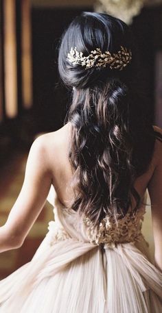 a woman with long hair wearing a dress