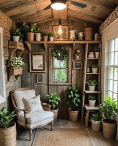 a room filled with lots of potted plants next to a window and a chair