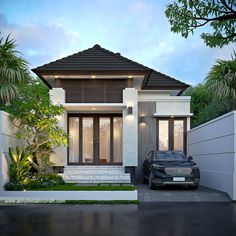 a black car parked in front of a white and gray house with palm trees around it