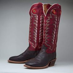 Tony Lama By Justin Brands 16in Carrizo Red Top Orthotic Insole Multi-Textured Rubber Outsole Square Toe Riding Heel Double Stitched 3/4in Welt 3R1027 You'll be sure to turn heads in the Rosston 16-inch tall 3R Buckaroo men's cowboy boot with a striking red leather upper accented by inventive white, red, and gold stitching and subtle white piping along the collar.The cowhide vamp features a bull hide print on a square toe and riding heel that allows for a relaxed fit in the stirrup. The orthotic Tony Lama, Mens Cowboy, Mens Cowboy Boots, A Bull, Stirrups, Cowboy Boot, Red Top, Red And Gold, Red Leather