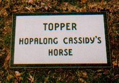 a sign in the grass that says topper hoping casssy's horse