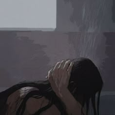 a woman with her head in her hands and the rain coming down on her face