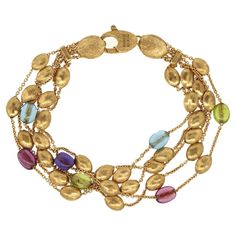 18 kt Yellow Gold - Brushed Length: 7 inches Semi-Precious Stones: Amethyst, London Blue Topaz, Peridot, Tourmaline Total Weight: 16.58 grams﻿ Lobster Clasp Closure Marco Bicego Bracelet, Marco Bicego, Strand Bracelet, London Blue Topaz, London Blue, Arm Band, Blue Topaz, Semiprecious Stones, Precious Stones