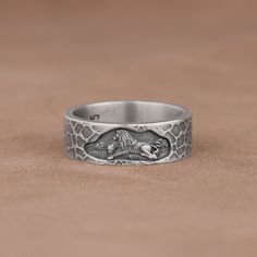 Lion and Lioness Mural Engraved Textured Band Ring, 925 Sterling Silver Animal Art Ring, Handmade Unsual Leo Promise Ring, Cool Wedding Band Made of 925 silver and handcrafted by hand, this ring is not only an accessory piece that complements your daily elegance, but also has details that will reflect your character and style. It is also a great gift to give to your loved ones on their special days. At SavisSilver, we always give importance to the satisfaction of our customers, we recommend you Adjustable Engraved Antique Silver Ring, Engraved Open Skull Ring As Gift, Engraved Skull Open Ring Gift, Engraved Open Skull Ring Gift, Adjustable Sterling Silver Engraved Ring Collectible, Silver Adjustable Engraved Snake Ring, Symbolic Oxidized Wedding Rings, Unique Stamped Silver Rings, Handmade Sterling Silver Snake Ring For Wedding