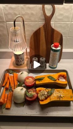 the tray is full of different types of vegetables and seasoning on top of it