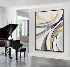 a living room with a grand piano in front of a large painting on the wall