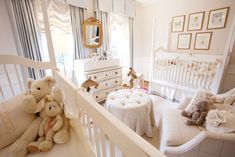 a baby's room with white furniture and teddy bears on the bed, crib