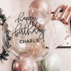 some balloons that say happy birthday charlie and have gold sprinkles on them