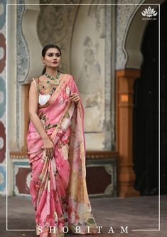 Does your wardrobe have a floral Saree yet? This saree in Crisp and comfy Linen by Linen is loaded with comfort and breathability. Ease of maintenance makes this even more attractive! It comes in a pleasing pink shade and has rose and other florals are rendered digitally! Muted zari borders highlight both edges. The saree is ready to wear with falls and pico done. Pretty designer tassels add charm. An unstitched blouse fabric is included. *Note: Color and shading may slightly vary due to lightin Pink Georgette Pre-draped Saree With Floral Print, Pink Floral Pre-draped Saree In Georgette, Pink Floral Print Pre-draped Georgette Saree, Pink Floral Pre-draped Georgette Saree, Silk Pre-draped Saree In Pink With Floral Print, Pink Silk Pre-draped Saree With Floral Print, Pink Floral Print Pre-draped Saree For Diwali, Pink Floral Pre-draped Saree For Diwali, Bollywood Style Pre-draped Pink Saree With Floral Print