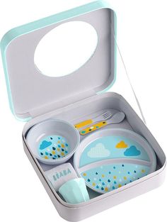 a little kid's dinner set in a box with spoons and plates inside