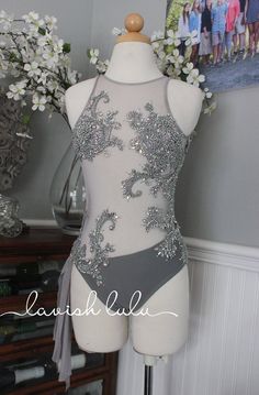 a mannequin is adorned with silver sequins