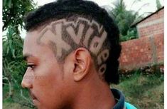 a young man with his hair cut into the shape of letters on his forehead and undercut