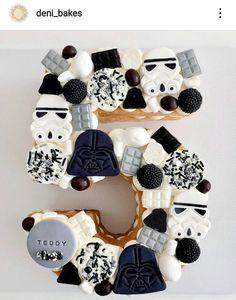 the letter e is made up of cookies and marshmallows as darth vader faces