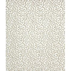 a white rug with small brown dots on it