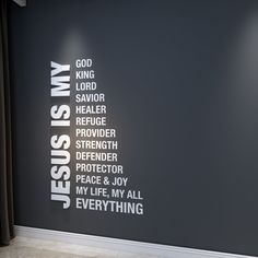 there is a black wall with white words on it and the word jesus is my