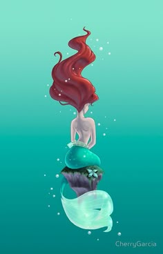 the little mermaid is sitting on top of a cupcake in the ocean with bubbles