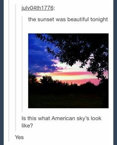 the sun is setting and it looks like they are looking at something in the sky