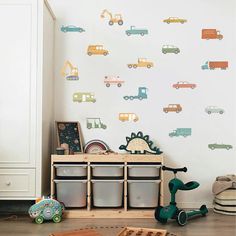 a child's room with toy trucks and cars on the wall