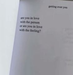 an open book with the words getting over you are you in love with the person or are you in love with the feeling?