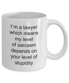 a white coffee mug with the words i'm a lawer which means my level of