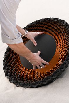 a person is touching the bottom of a basket