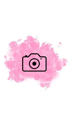 a camera with pink paint splattered on it