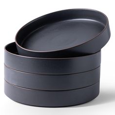 three black plates stacked on top of each other