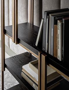 a book shelf with books and magazines on it