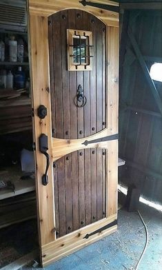 an open wooden door in the corner of a room