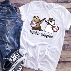 This listing is for a CARTOON style portrait t-shirt. If you want a more realistic, illustrated style, click here: https://www.etsy.com/listing/600225232/custom-pet-portrait-t-shirt-realistic?ref=shop_home_active_6&frs=1 A funny portrait of your pet that YOU get to art direct--and wear on a t-shirt! Dream up something good, and tell me what you want. (If your idea is super complex, there may be an additional fee.) AFTER ORDERING: Convo me or email me at stacey@sockdogs.com with a photo of yo Custom Pet Shirt, Cotton T-shirt With Cat Design As Gift, Casual T-shirt With Cat Design As Gift, Custom Pet Portrait Shirt, Cheap Short Sleeve T-shirt With Cat Design, Cat Shirt, Custom Shirt, Cat Lover Gift, Mom Gifts