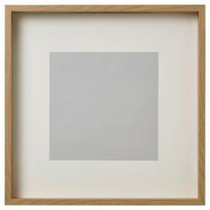 an empty square in a wooden frame on a white background with light brown trim around the edges