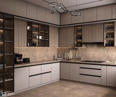 a modern kitchen with white cabinets and brown counter tops, is pictured in this image