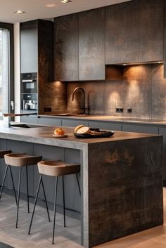 a modern kitchen with an island and bar stools