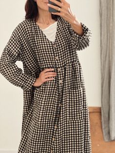 "* 100% soft linen  * V-neck * Long sleeve  * Pockets  * Handmade in Slovakia   * The model is 5'12\"/ 184 cm tall: - wearing size M/L, color beige/black checks    Measurements in inches/cm: Size XS/S - cloth (laid on the floor): Bust: 19,5\"/ 50 cm Waist: 19,5\"/ 50 cm Length (from the neckline to the hem measured from the back): 45\"/ 115 cm --- Size S/M - cloth (laid on the floor): Bust: 21\"/ 54 cm Waist: 21\"/ 54 cm Length (from the neckline to the hem measured from the back): 47\"/ 120 cm --- Size M/L - cloth (laid on the floor): Bust: 23\"/ 58 cm Waist: 23\"/ 58 cm Length (from the neckline to the hem measured from the back): 49\"/ 125 cm" V-neck Linen Dress With Buttons, Oversized Linen V-neck Dress, Casual Oversized Linen Fall Dress, Casual Oversized Linen Dress For Fall, Fall Button-up Linen Dress, Casual Linen Long Sleeve Dress With Button Closure, Casual Long Sleeve Linen Dress With Button Closure, Casual V-neck Linen Dress For Fall, Oversized Linen Button-up Dresses