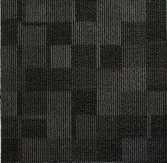 a black and gray rug with squares on it