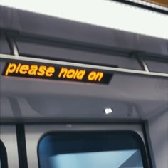 there is a sign that says please now on the train