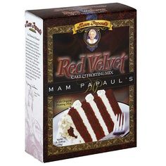 a box of red velvet cake sitting on top of a white plate