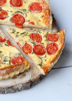 slices of pizza with tomatoes and cheese on top