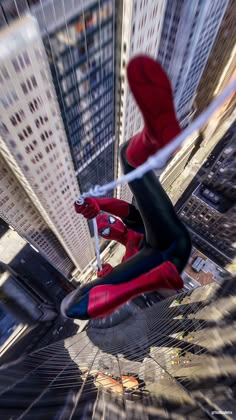 the amazing spider - man is flying through the city