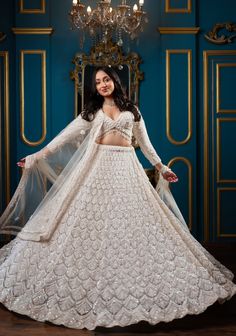 Item: Lehenga Set ( Lehenga Skirt, Blouse and Dupatta) Step into modern royalty with our Enchanting Magnolia Bridal Lehenga. Expertly crafted by our artisans, this ensemble is a perfect blend of tradition and contemporary design. Each embellishment is intricately placed, showcasing the sheer hard work and dedication that goes into every detail. Let us customize your lehenga to reflect your unique style and make your wedding day truly unforgettable. This bespoke lehenga curated with love and care Fitted Sharara With Chikankari Embroidery For Reception, Elegant Navratri Choli With Chikankari Embroidery, Elegant Choli With Chikankari Embroidery, Traditional Dupatta Sets For Ceremony, Traditional Drape Lehenga With Chikankari Embroidery For Reception, Traditional Ceremony Sets With Dupatta, Ceremony Sets With Traditional Drape Dupatta, Semi-stitched Traditional Drape Set For Ceremony, Elegant Choli For Ceremony With Traditional Drape